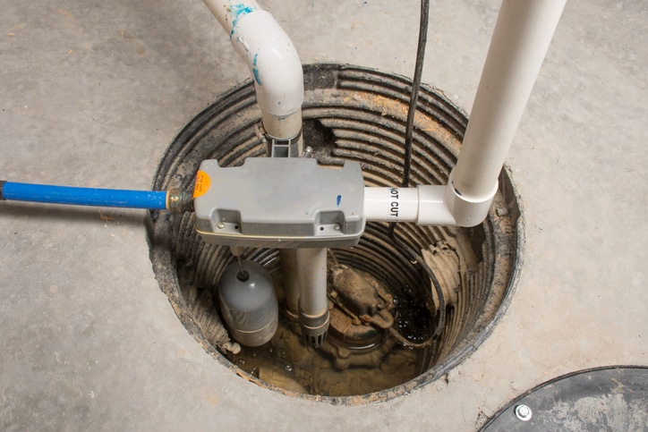 A sump pump installed in a basement of a home.