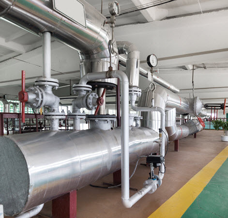Large commercial boiler in a dedicated boiler room