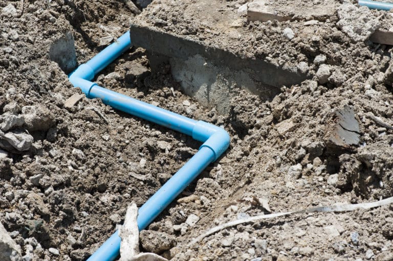 water line on the ground with brown dirt